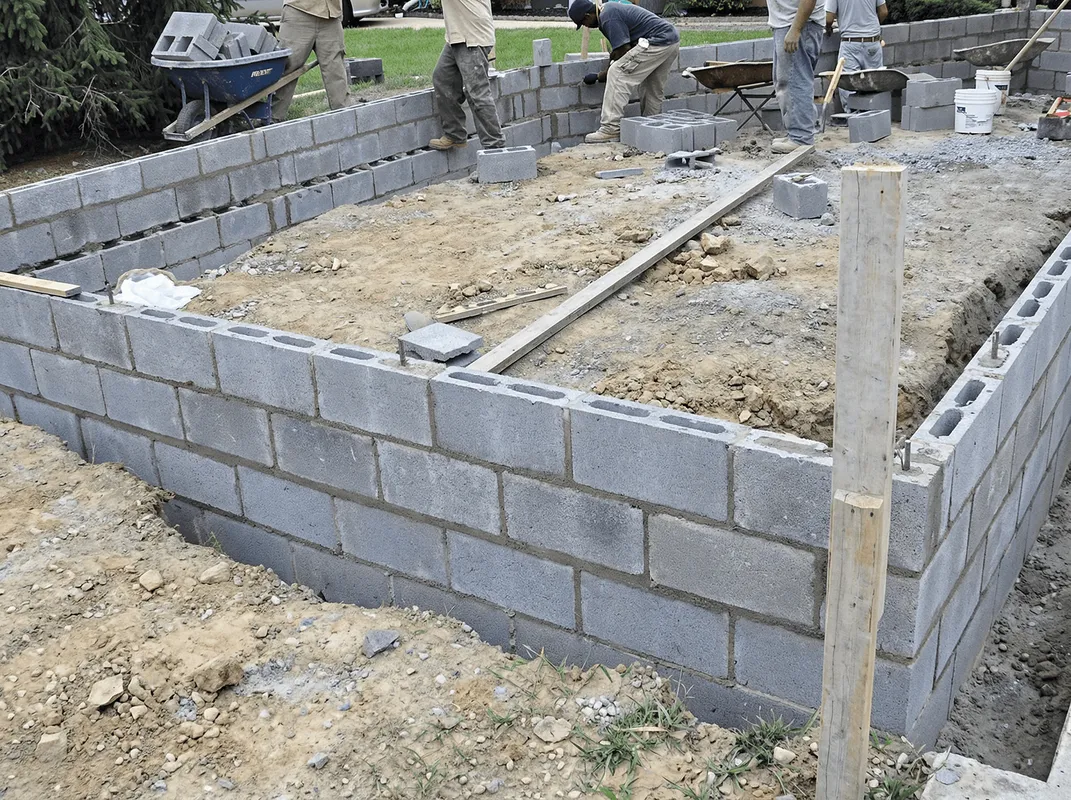 Professionals building a foundation with blocks in Mobile, AL